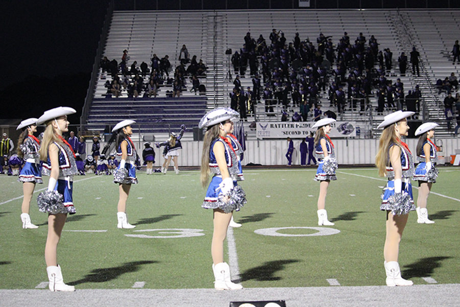 Silverados await the football team's run-through. They will perform again tomorrow in the auditorium for this year's Spring Show.