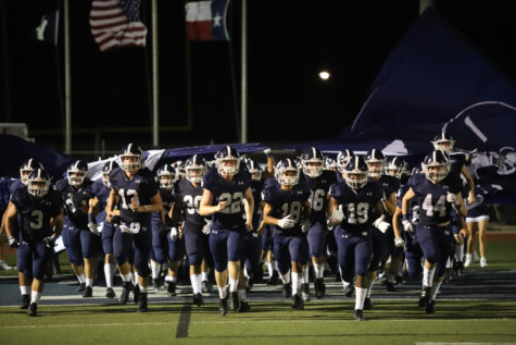 The Rangers run out onto the field prior to last season's 24-23 loss to the Lee Rebels. The two teams face off again in Midland this Friday.