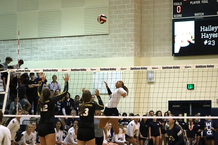 During the Sept. 20 match against East Central at home, junior Esther Duglas spikes the ball in a 3-0 win.