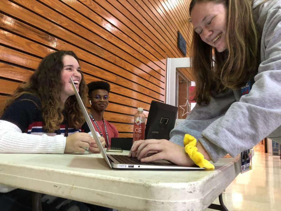 As ticket sales start edtoday, the homecoming craze begins. Students Caitlyn McIntyre, Kimberly Heifetz and Vincent Seay gather in the senior dining hall during C lunch to promote homecoming ticket sales and gather nominations for the homecoming court.