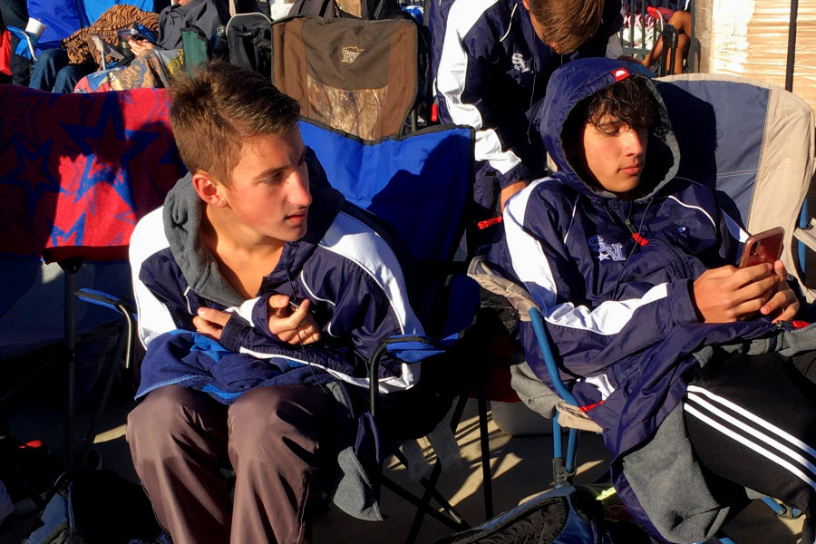 Ranger swimmers Mason Klein (left) and Cole Wagemen try to stay warm at Friday's swim meet. The boys placed 3rd overall at the meet.