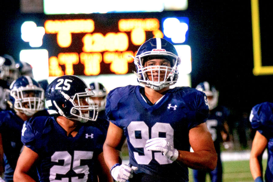 Juniors Americas Sanders (left) and Trey Moore jog onto the field prior to a 15-7 loss to Schertz Clemens. The pair have a big responsibility slowing down East Central RB DeAngelo Rosemond.