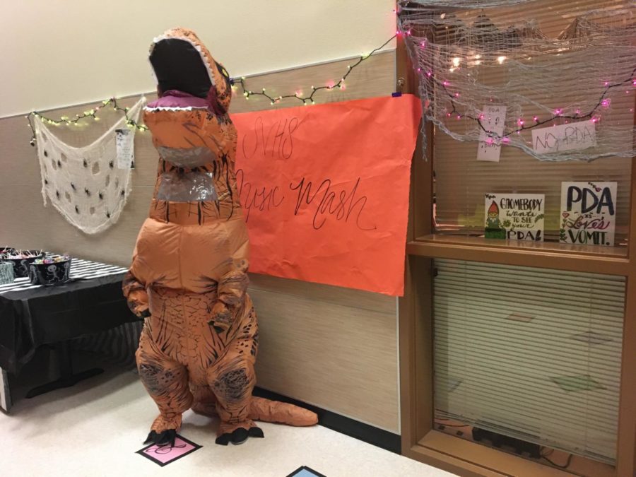 Forget the Monster Mash - piano teacher Alicia Boudier brings out the T-rex costume for the piana class's musical rounds game.