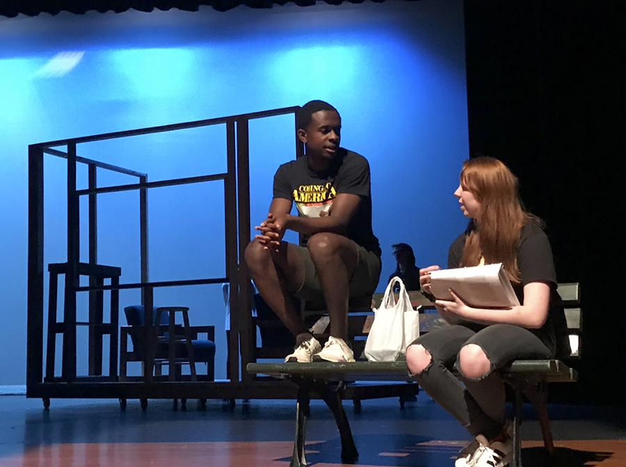 During rehearsal for 'Middletown,' senior Caleb Mosley and junior Brenna Collins converse about their roles.