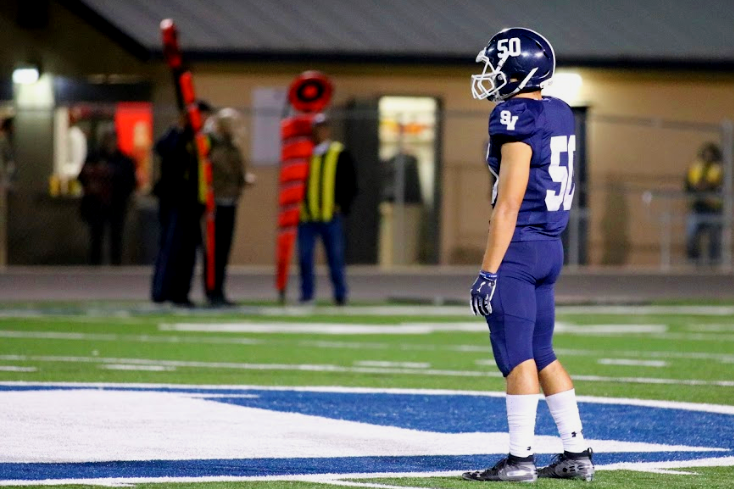 Carson Padilla stands alone at midfield during a game against East Central. Padilla was constantly in the Knights' backfield Friday night, but it wasn't enough.