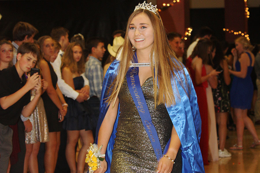 At Saturday's homecoming dance, senior Mackenzie Ramos dons her cape and crown  as the 2019 homecoming queen.