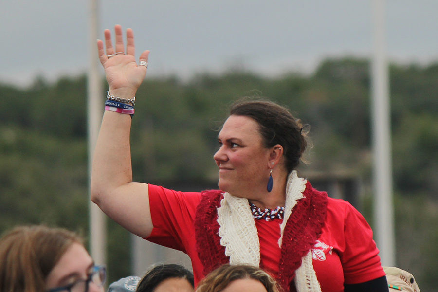 During today's Veterans Day ceremony, algebra teacher Lauren Boswell acknowledges the applause as she is recognized as a veteran.