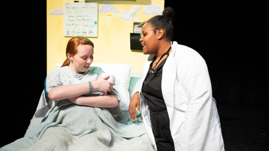 After the hospital prop is built, Junior Brenna Collins and freshman Chaya Powell rehearse a scene from 'Middletown.'