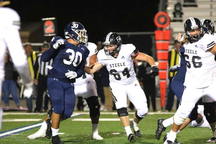 Star DT Trey Witcher rushes the passer during a loss against Steele. Witcher picked up a sack in his final high school game on Friday at Lake Travis, a 21-3 loss.