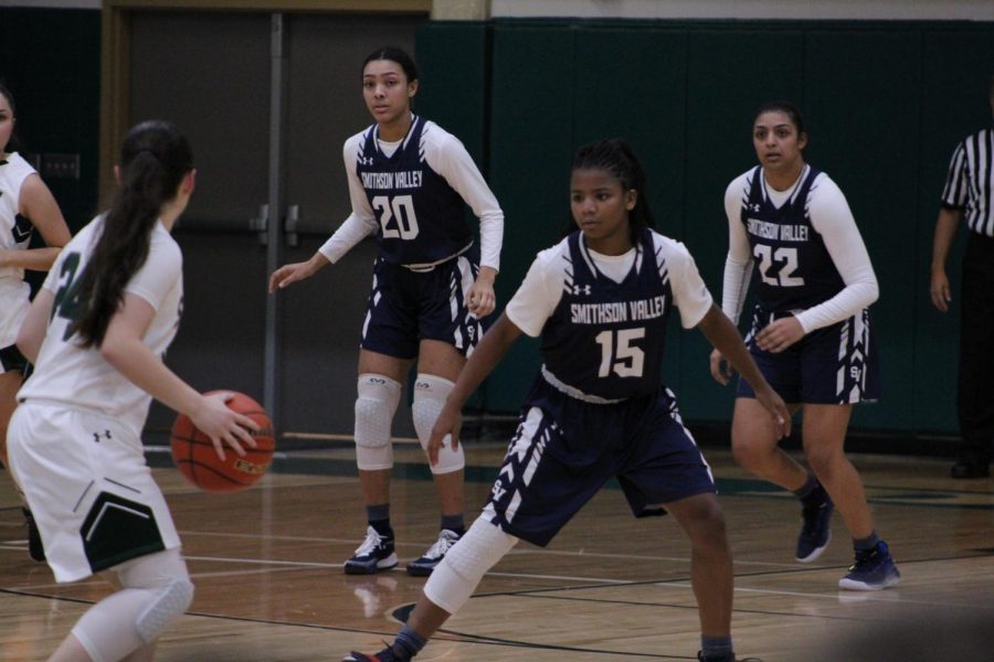 Junior guard Trinity Garrett plays defense against Laredo Alexander High School. Garret set the school career assists record this week with 234.