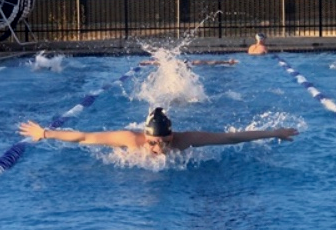 Senior Brianna Houlahan warms up for district competition. The meet will be held on Thursday