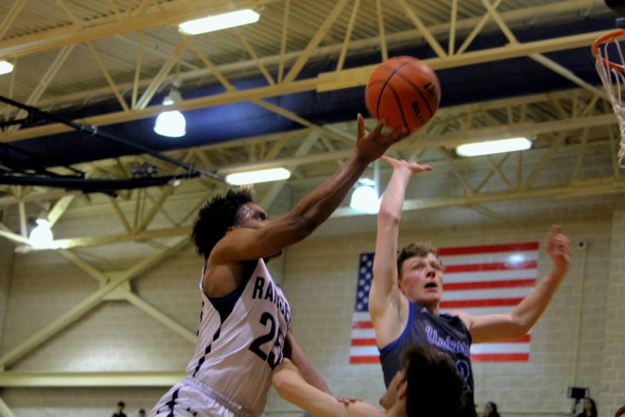 Senior guard Armel Talla attempts a layup against New Braunfels. Talla scored eight points in the 61-54 loss.
