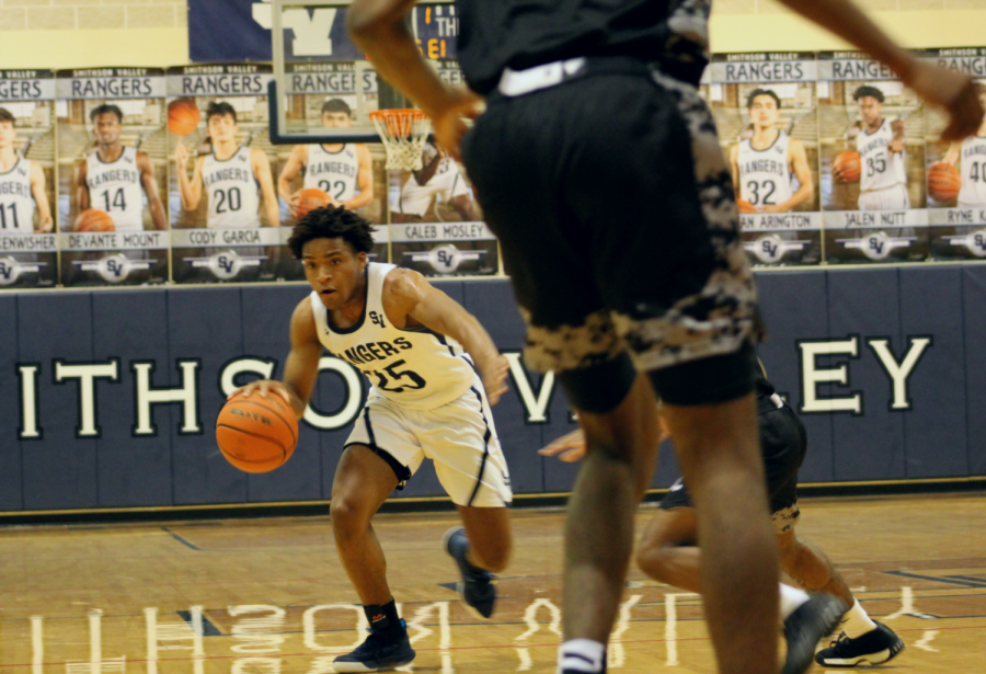 Senior guard Armel Talla charges the lane during a win over Cibolo Steele. Talla scored 18 points in each of the team's past two games.