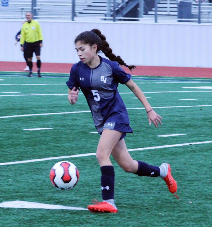 Sophomore Tatianna Herrera takes the ball up the line in a preseason game against Uvalde, in which the Rangers won 10-1.