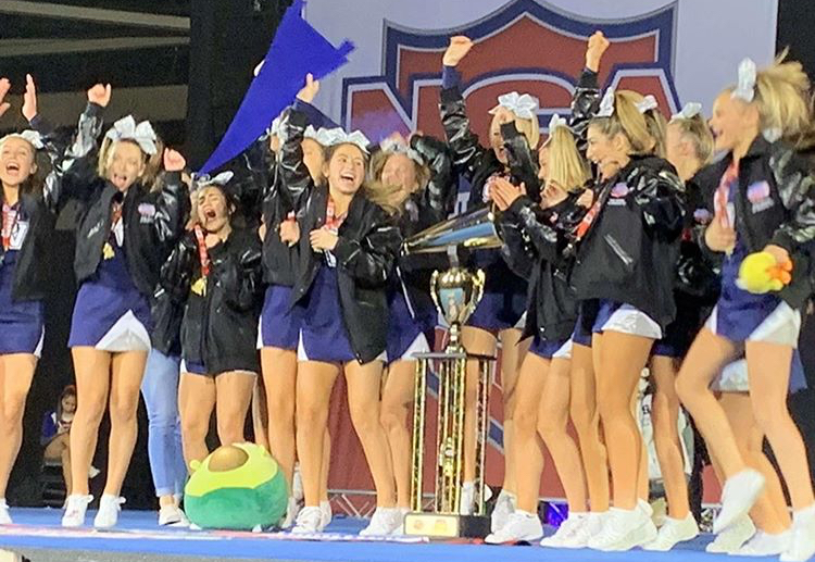 The freshman cheer squad celebrates winning first place at the National Cheer Association competition in Dallas.
