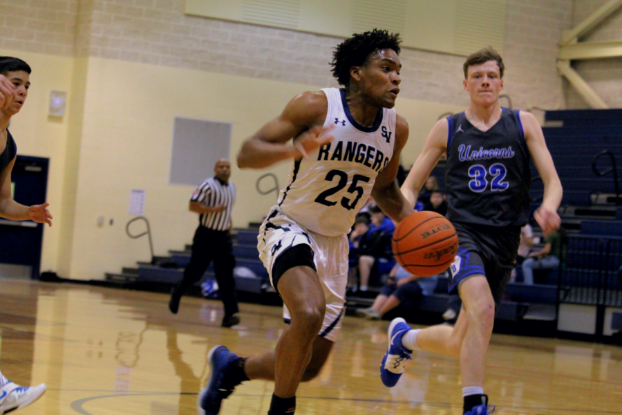 Armel Talla drives for a layup against New Braunfels. Talla, a senior, averaged 5.6 PPG this season.