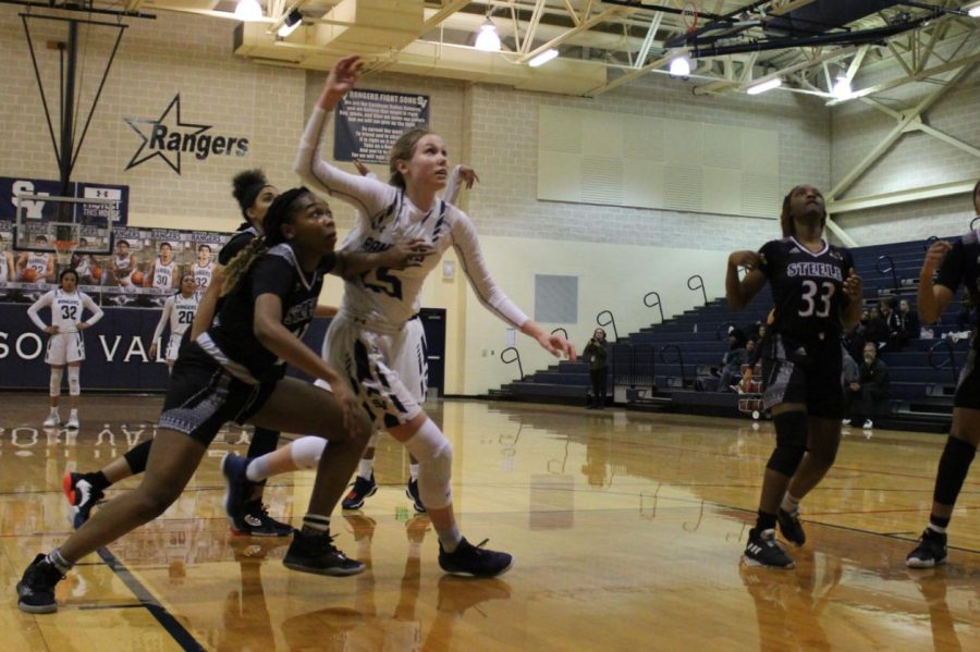 Sophomore Gabby Elliott fights for a rebound during last year's regular-season finale against Steele.