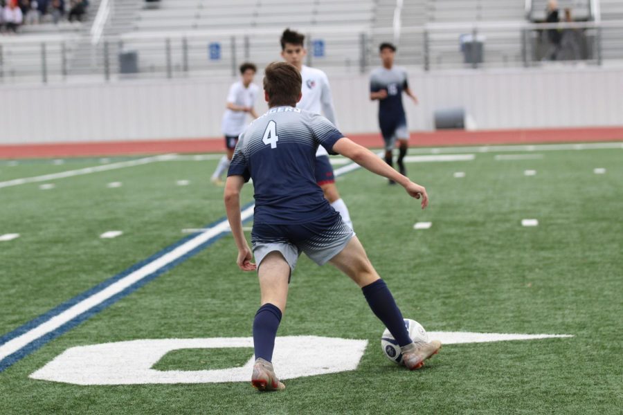 Sophomore Alex Franz dribbles the ball down the pitch. Boys soccer is 9-5-4 this season.