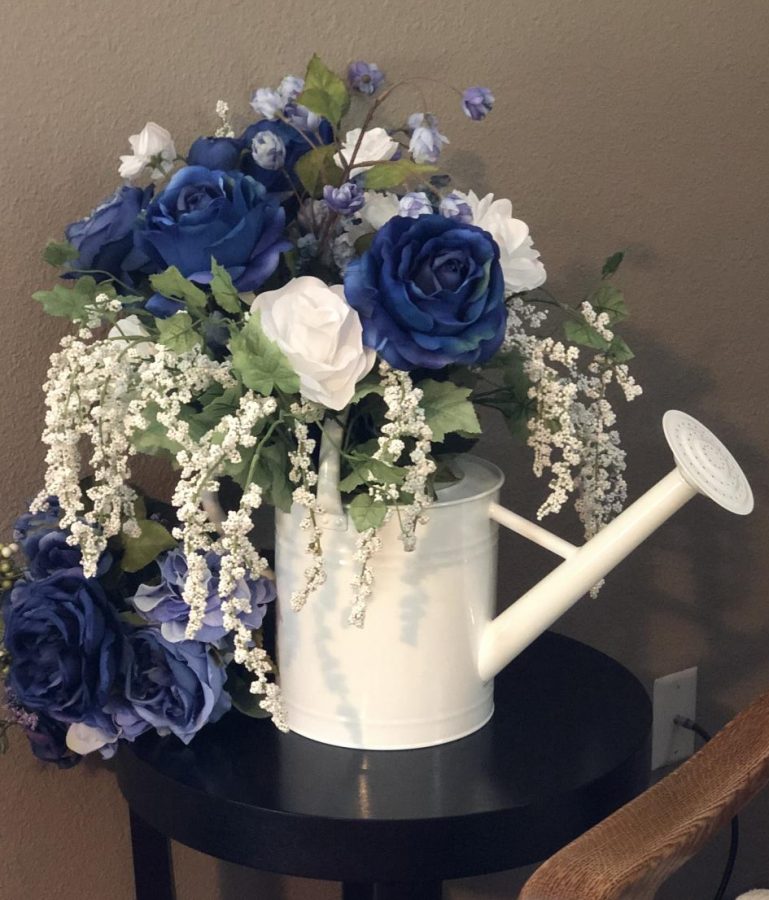 The flower watering can  remained in teacher Claudia Barthuly's car until today because it reminded her of prom.