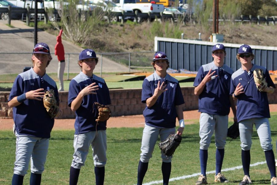 in the moment 
baseball players pose for picture 
the team beat Clemens 100-0 on Thursday   