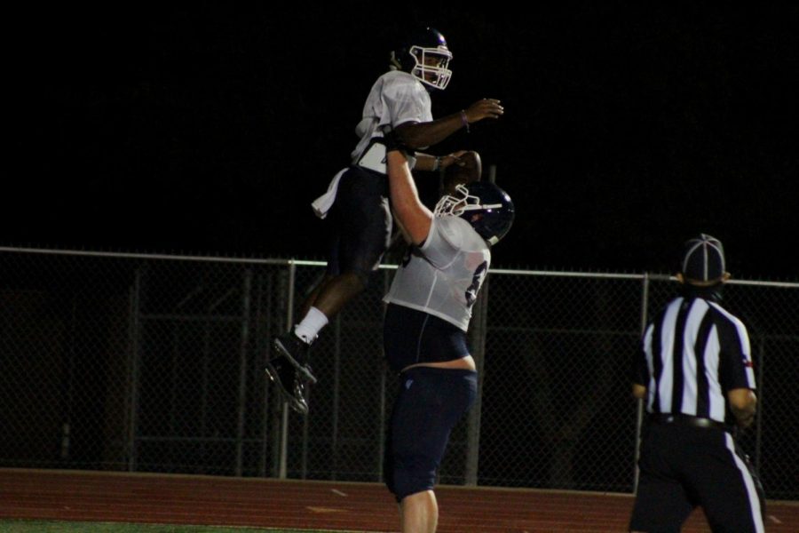 Jalen Nutt and Colton Thomasson celebrate a touchdown during football's preseason scrimmage. Nutt racked up 210 yard and two touchdowns on Friday en route to a 45-27 win over Harker Heights.