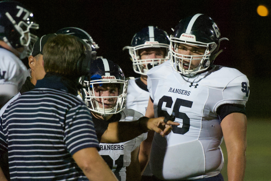 Coach Larry Hill rallies the troops during their last game. Tonight's showdown against New Braunfels was cancelled due to coronavirus concerns.