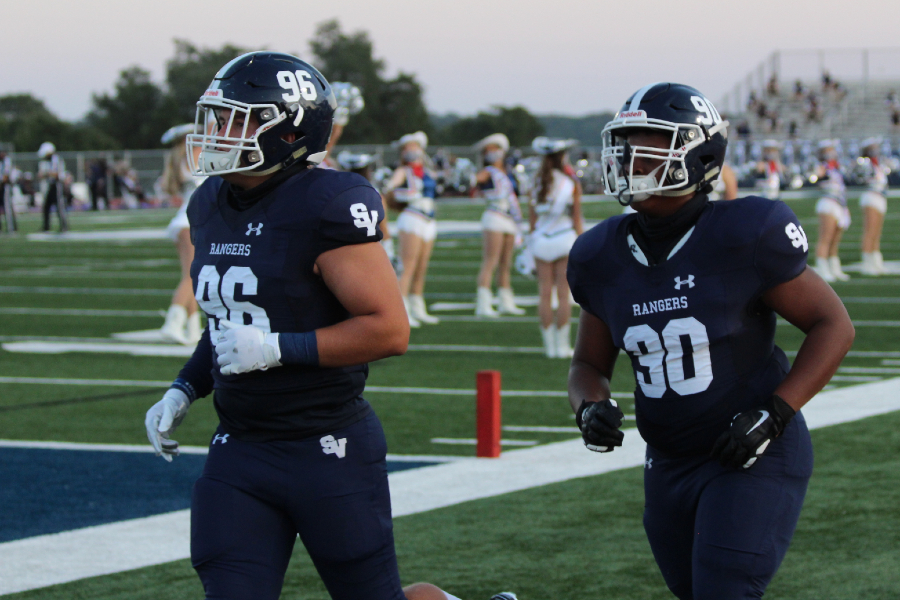 Defensive tackles Luke Seminaro (left) and Jordan Thompson warm up before a game. The defensive line will have its hands full on Thursday against New Braunfels and running back Ryker Purdy (580 yards, 8 touchdowns).