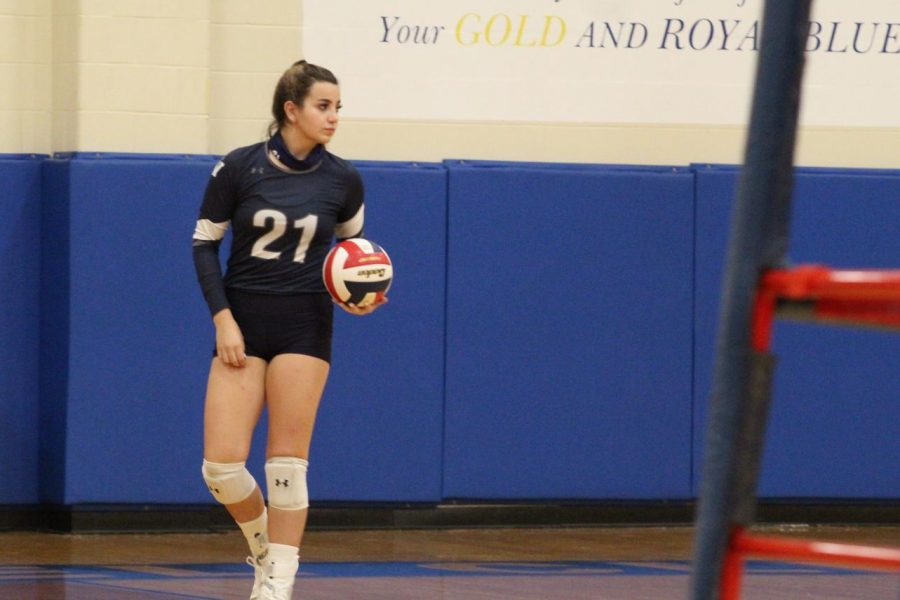 Maddie Dennis gets ready to serve against the Clemens Buffaloes