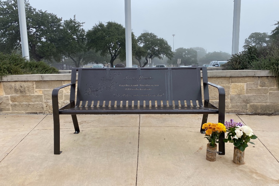 Former students Kayleigh Klinksiek and Rebekah Mann placed flowers next to Stacie Younts' bench in honor of their teacher's death. The flower vases were made by Klinksiek's dad.