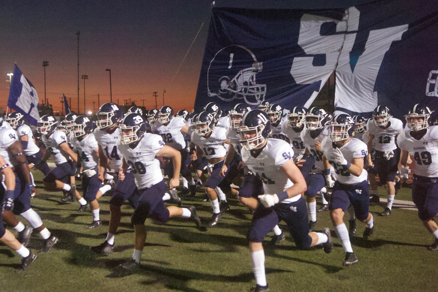 Football charges the field before a loss to Wagner. They'll have an impromptu bye this week after contact tracing at Judson forced this Friday's game to be postponed.