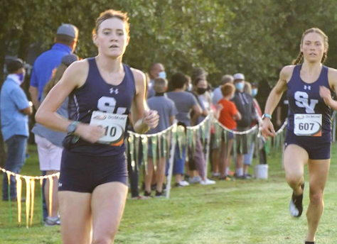Sara Scott takes the lead at the Cedar Park Invite, Amalie Mills close behind.