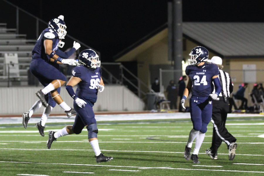 Luke Seminaro (96) celebrates a sack with his teammates. The defense will have their hands full this week against Judson's dynamic offense.
