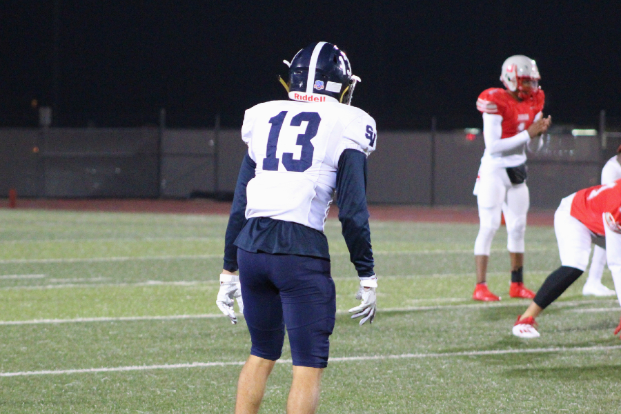Noah Flores prepares for a snap. Flores made plenty of key contributions to Friday's 24-20 win, including an interception and long punt return.