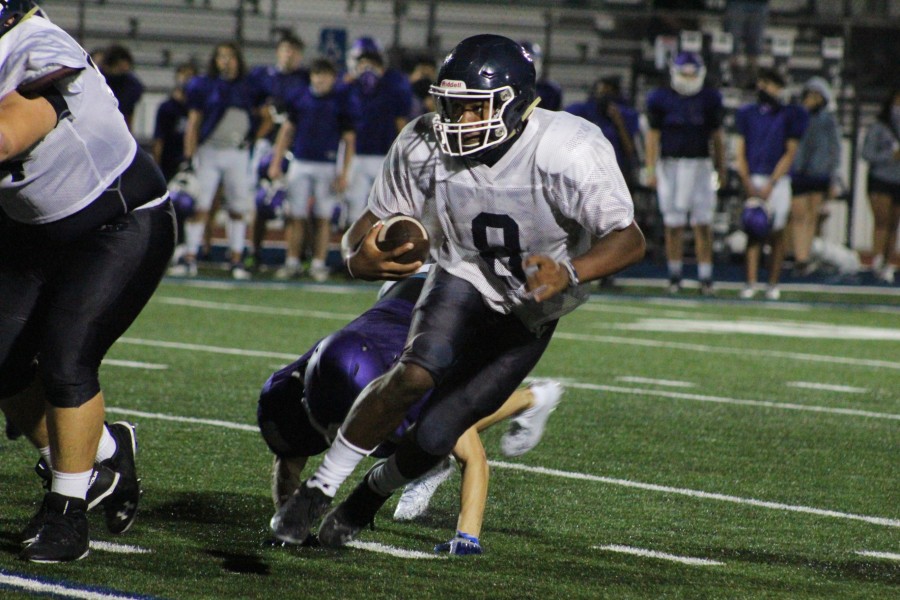 Jalen Nutt weaves through the San Marcos defense. Nutt has compiled 1,661 total yards and 17 touchdowns in his first season as a varsity quarterback.