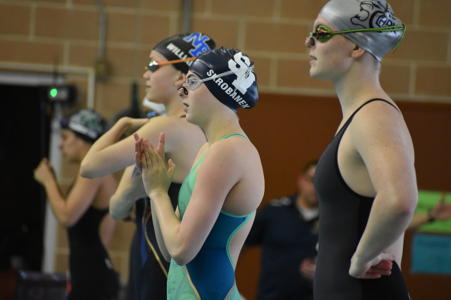 Laney Skrobanek warms up for the 100 back at the 2019 regional chamionships.