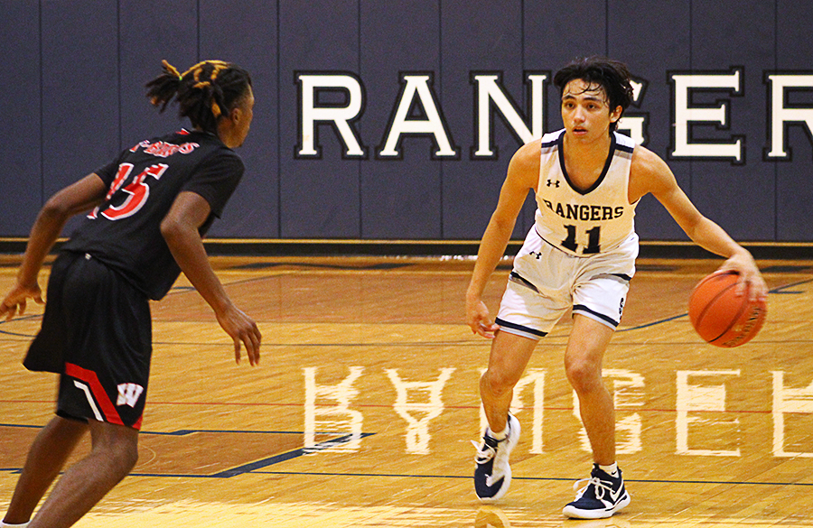 In a close game against Wagner, senior Tristan Ortiz takes on a Thunderbird in the 54-59 loss. Injured last season, Ortiz is second to Zayden High in points thus far, averaging 11.5 per game.