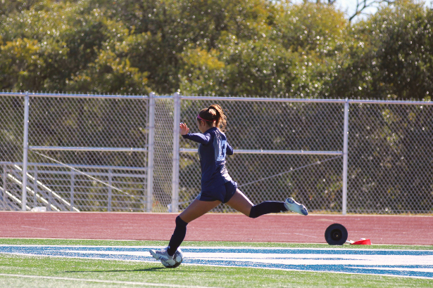 Sophomore Kaili Castillo takes a free kick from the Rangers' defensive third. The girls won all three games in their Ranger Classic tournament, bonding as a team before district play.