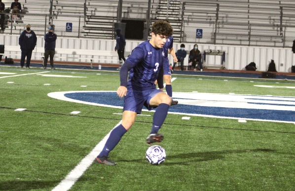Captain Devin Yocham takes the ball down the field in the Ranger's game against Clemens. The Buffs won 2-1 and stand at first in the district.