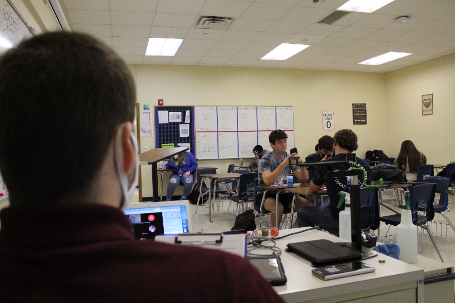 Math teacher Troy Wyant instructs his second period students both online and face-to-face.