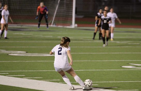 Senior Helene Farris takes a free kick in the district championship against Steele. Farris committed to play soccer at UTSA last month, and this year is her first at Smithson Valley.