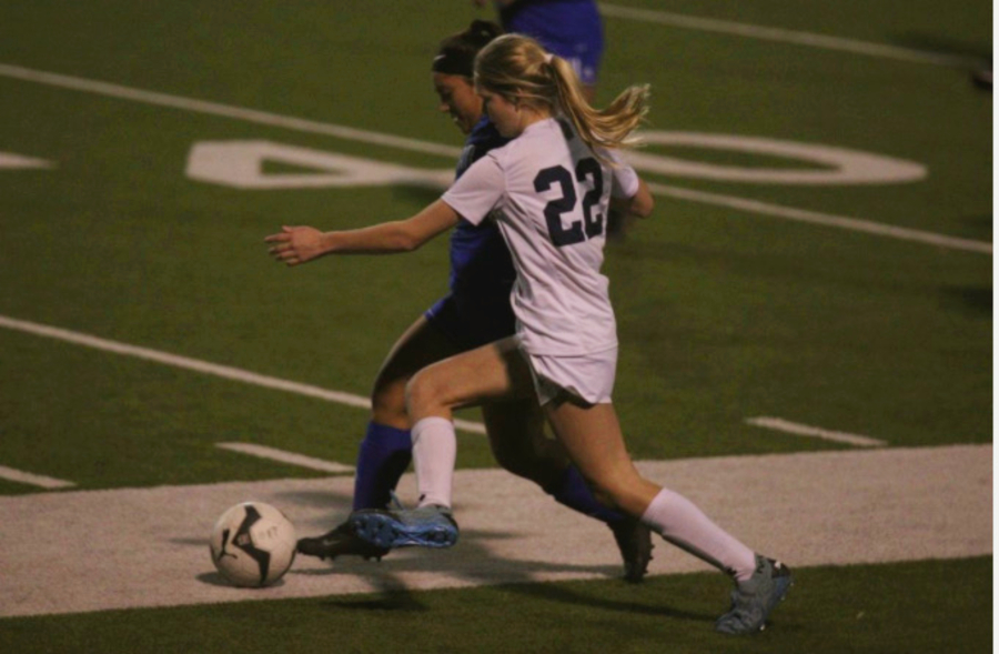Sophomore Malia Thalman fights for possesion at South San on March 3. Against the Bobcats, Thalman scored one goal and had two assists.