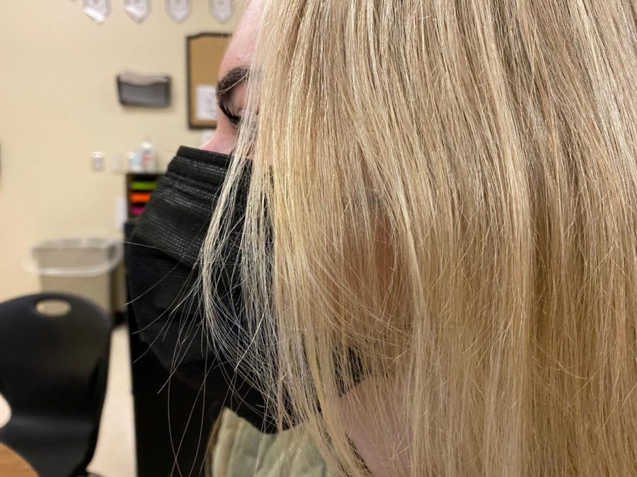 Many students are continuing to wear masks on campus, despite the district lifting the mandate.