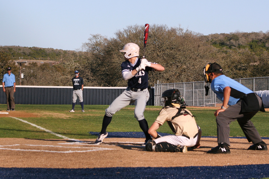 Kasen Wells rears back to swing against Harlan. It'll be a lot easier for Wells to zone in if he takes our walk-up song advice.