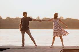 During one of the many musical numbers, Will and Avery are romantically dancing on the deck of the camp pier.