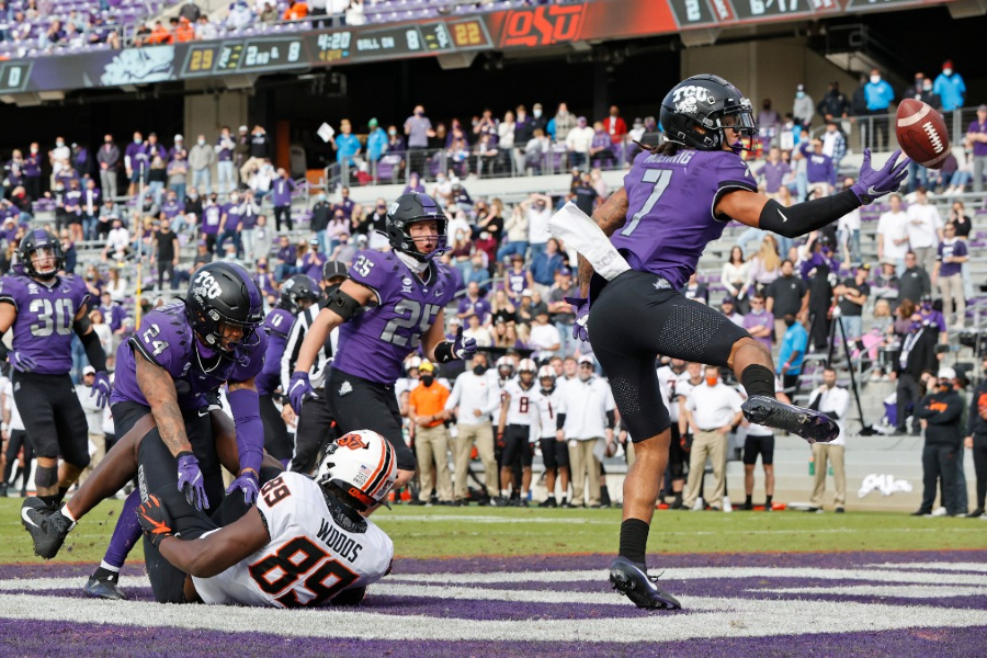 Toe-tapping in the back of the end zone, Tre'von Moehrig tips an interception to himself. Moehrig, a Smithson Valley alum, is widely expected to be selected in the first round of this weekend's NFL draft.