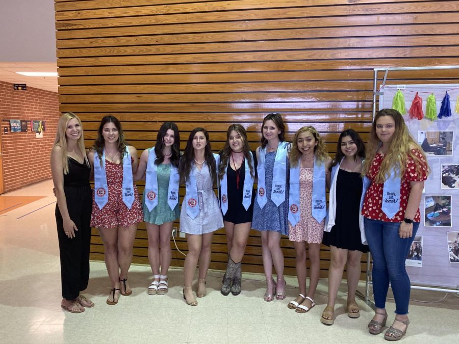 Valerie Grona (far left) meets with other 'Ready Set Teach' graduates May 5 in the senior dining hall.