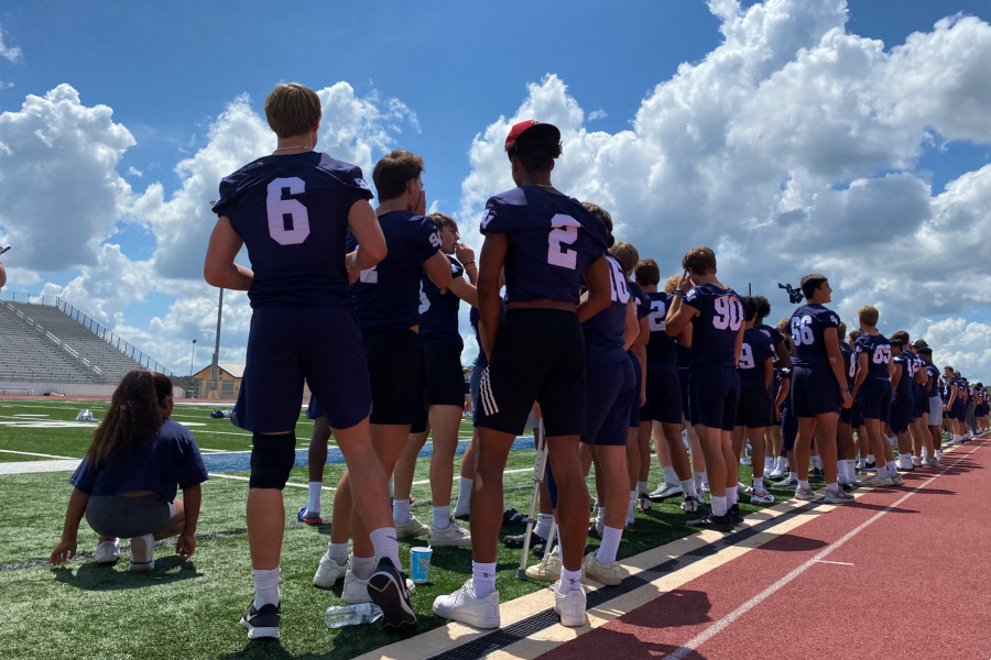 Football prepares to lead a cheer during media day. The Rangers will kick off their season on Friday at Warren.
