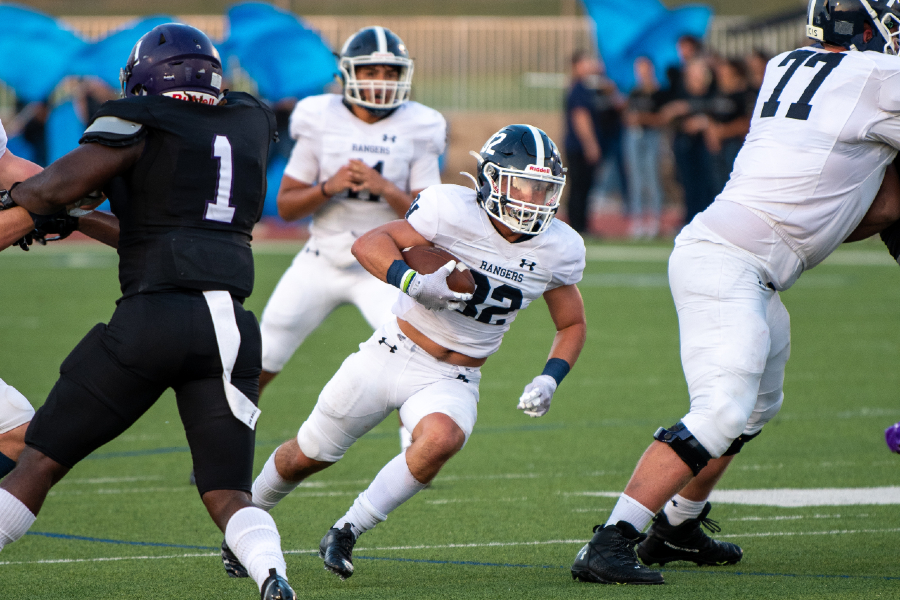 Travis McCracken cuts upfield against Warren. McCracken, a senior, led the Rangers in rushing yards in Friday night's 28-0 win over Madison.
