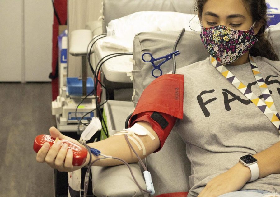 Former student Katelyn Obregon gives blood during the 2020 blood drive.