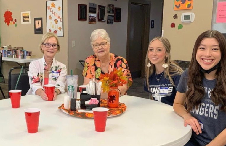 FCCLA members Ashley Villarreal and Aly Pelletier chat with seniors Joyce and Japka.